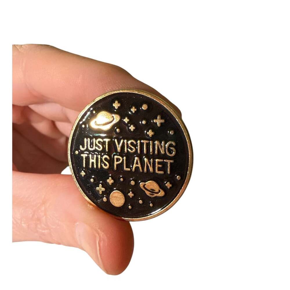 Just Visiting This Planet Enamel Lapel Pin Black Gold Space Badge